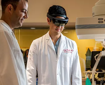 Penn IR Doctor Terence Gade and former resident Brian Park testing AR technology 